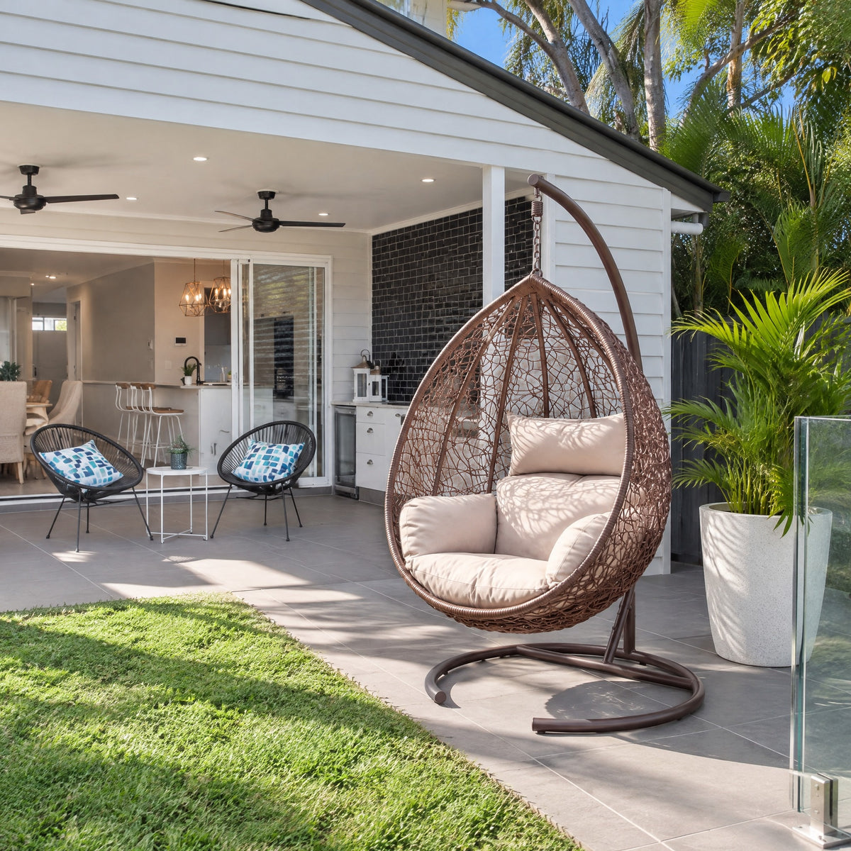 Hanging Rattan Egg Chair with Stand - in an Australian backyard