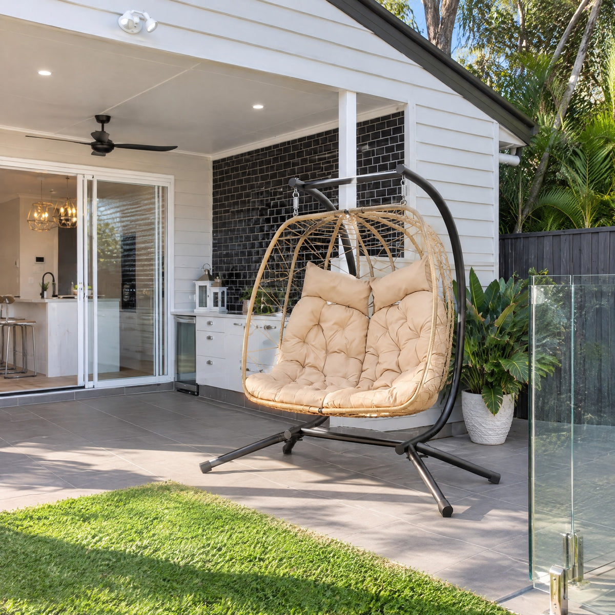 Double Hanging Egg Chair with Stand - in an Australian backyard